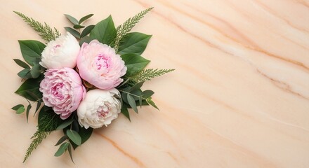 A bouquet of light pink and white peony blossoms with eucalyptus and needle-like foliage on a beige marble background