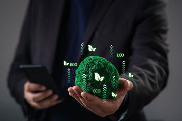 Businessman holding a green eco globe with growth arrows and leaf icons, symbolizing sustainable innovation, green energy, environmental awareness, digital transformation toward eco-friendly future.