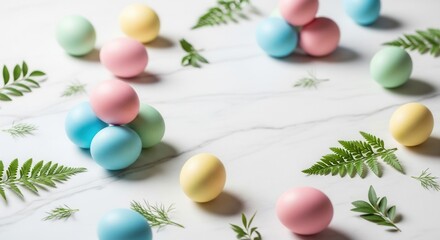 Brightly colored eggs in pastel shades with green foliage scattered on a white veined surface
