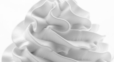 Close-up of smooth white creamy swirls forming distinct peaks and valleys emphasizing the texture and intricate pattern of the soft material