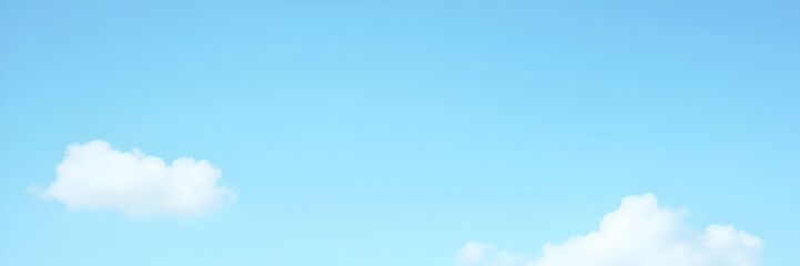 A serene sky blue background with fluffy clouds, evoking calmness and tranquility. Ideal minimalist composition with generous copy space for text.