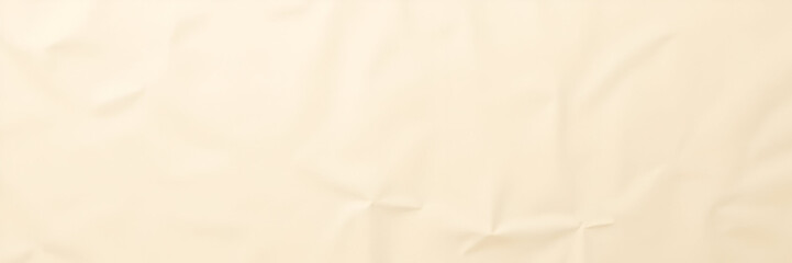 A background of light beige wrinkled paper recycled from packaging creates a subtle, textured aesthetic ideal for artistic displays or creative presentations, featuring ample space for text.