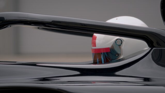 A fast racing car stands on the starting grid before the race