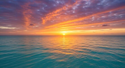 Fototapeta premium 鮮やかな赤橙色の夕焼け雲が広がり穏やかな青い海面に太陽の黄金色が美しく反射する幻想的な光景. AI Generated