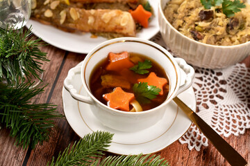 Traditional Christmas Eves supper with mushroom soup, sauerkraut and fried carp