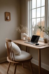 Cozy home office with modern desk, decorative elements, and natural light in serene environment