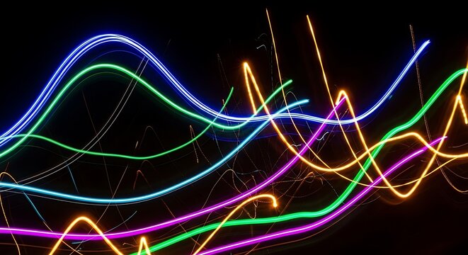 Abstract swirling neon light trails in vibrant blue green purple and orange against black