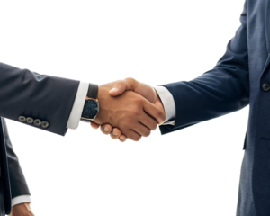A close up shot of two business people shaking hands wearing suits in front of a black background