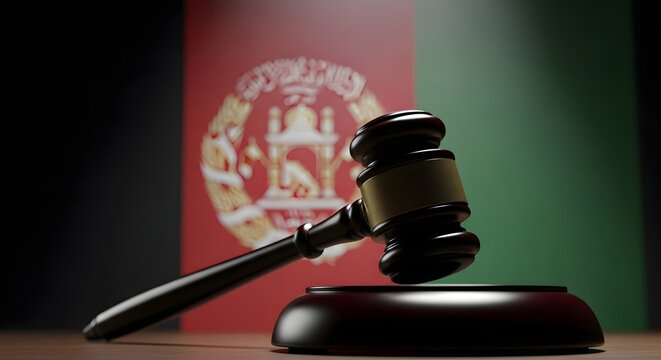 Justice and law in afghanistan symbolized by gavel and national flag