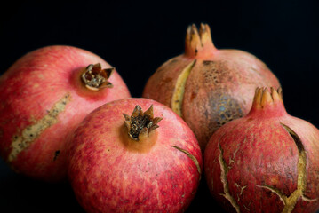 Pomegranate Still Life on Black Background – Vibrant Red Fruit, Natural Texture, Healthy Food Concept