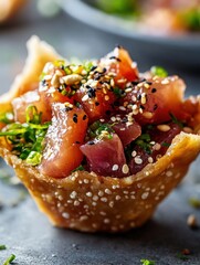 A poke taco with marinated tuna, seaweed salad, and sesame seeds in a crispy wonton shell