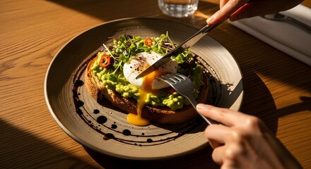 Enjoying a Healthy Breakfast of Avocado Toast with a Poached Egg.