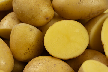Halves of raw potatoes close-up. Fresh organic vegetables