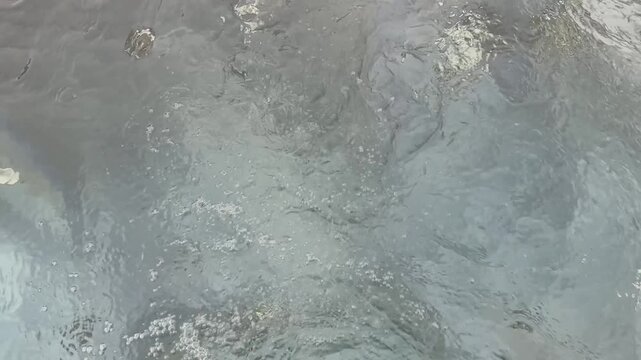 Bubbling water with massage jets in a hot tub spa