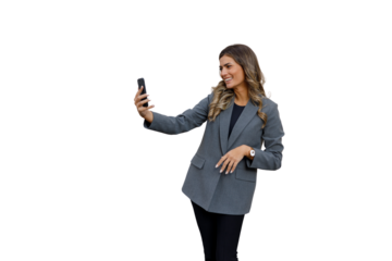 Smiling young businesswoman taking selfie using smartphone, enjoying social media on transparent background