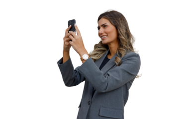 Businesswoman taking selfie with smartphone, smiling, creating social media content, isolated on transparent background