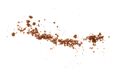 Flying biscuit crumbs isolated on transparent background, sweet cookie fragments and crunchy cracker pieces for food design and dessert decoration