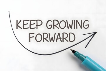 Obraz premium Inspirational Message Encouraging Personal Growth and Progress With a Pen on Paper