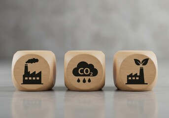 Industrial pollution and environmental impact depicted on wooden cubes