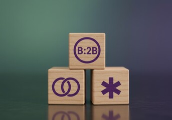 Three wooden blocks with symbols on a reflective surface against a gradient background viewed from a slight angle
