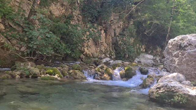 Waterfall Capelli di Venere, small mountainside cascade surrounded by vegetation, close to a ruined mill, Casaletto Spartano, Province of Salerno, Italy