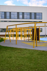 Outdoor yellow climbing structure at school playground