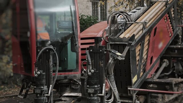 The machine operates horizontally at an inclined angle when laying pipes in the ground. The HDD machine makes a hole in the ground for laying underground utilities.