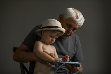 Portrait of Grandfather and Grandson in Soft Natural Light