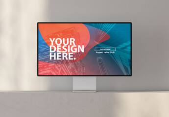 Monitor Screen Mockup on concrete cube in room with shadows from window