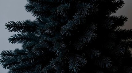 A jet-black Christmas tree with deep shadows, commercial quality