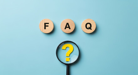 Wooden blocks with faq letters and question mark under magnifying glass on blue background