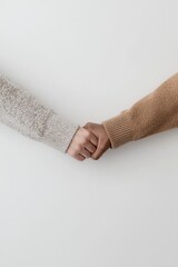 Two people holding hands in cozy sweaters, symbolizing unity, trust, connection, and warmth in minimalist style