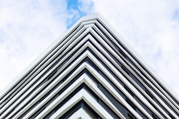 A modern building with a geometric façade. Straight lines and clear shapes create a sense of...