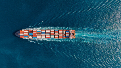 Aerial top view container cargo ship full speed with beautiful wave. © Teppakorn