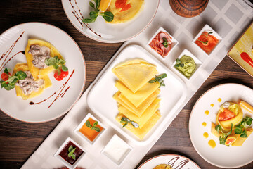 Delicious butter pancakes served with sauces in a restaurant. Gourmet breakfast with elegant presentation and rich flavor.