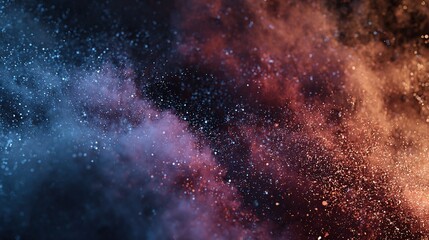 A colorful explosion of particles with blue and orange hues creating an abstract, ethereal effect