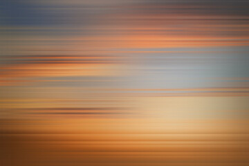 Abstract horizontal striped gradient background with orange and blue sunset tones, offering a modern textured digital backdrop design.