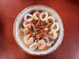 Steamed Seafood in Lime Sauce, Delicious Steamed Seafood Platter with Shrimp and Squid in Lime and Chili Sauce