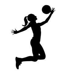 silhouette of a woman jumping with ball