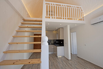 Living room in unfurnished apartment with mezzanine