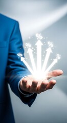 Businessman's open palm displays glowing upward arrows symbolizing growth success innovation and new ideas