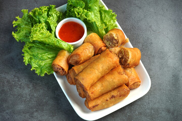 Crispy spring rolls served with fresh lettuce and sweet chili dipping sauce.