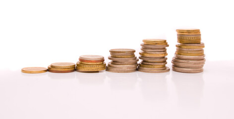 Coins Stacked on White Background