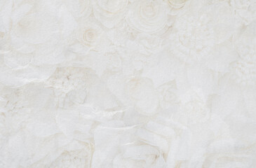 Abstract white stone wall with flower pattern background, blank white wall background