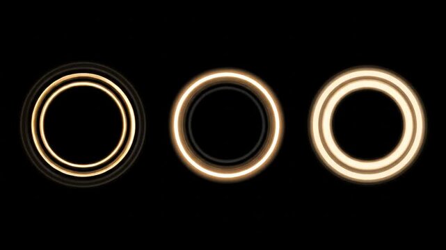 Three concentric, glowing circles in various shades of gold float on black backdrop