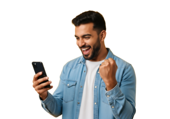 Young Indian man, early 20s, dark curly hair, beard, denim shirt, smiling, focused on smartphone, triumphant fist, vibrant yellow studio background, concept of digital success