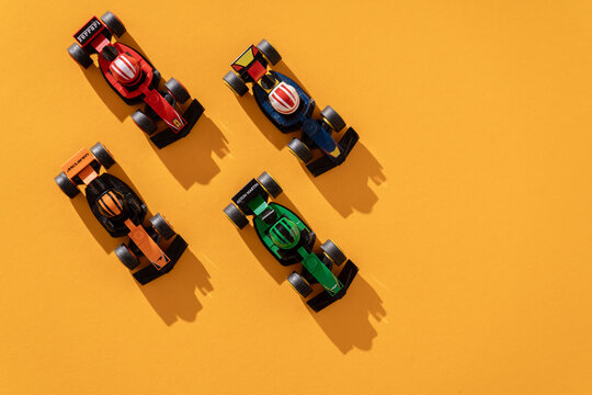 Ukraine, Kyiv - September 18, 2025: Toy car Formula 1 Lego set. Ferrari, Aston Martin McLaren formula one team race game. Top view background