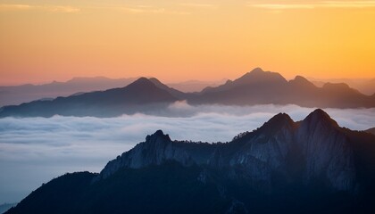 misty mountain peak sunrise view