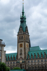 Historic clock tower building under cloudy sky