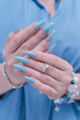 Silver dragon ring in woman's hands